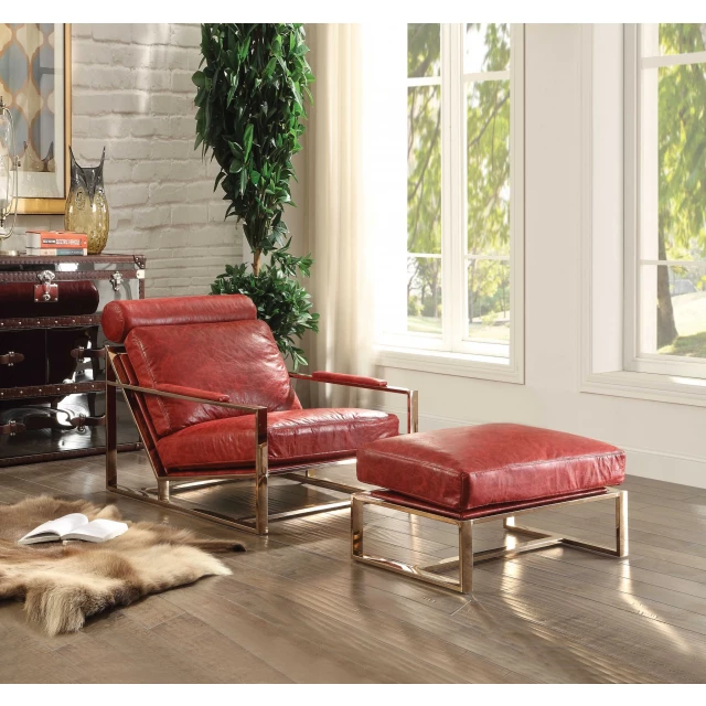 Antique red leather accent chair in a cozy living room with wood accents