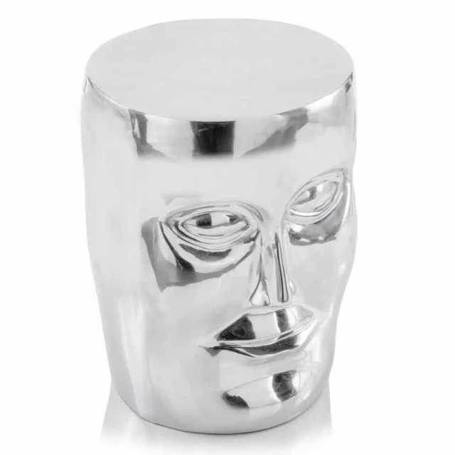 Silver aluminum face stool surrounded by glasses drinkware tableware serveware with a vase and jewellery elements