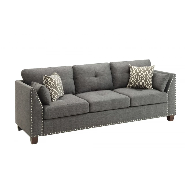 Dark brown linen sofa with toss pillows and comfortable studio couch design