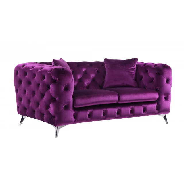 Purple silver velvet loveseat with pillows in a comfortable studio couch design