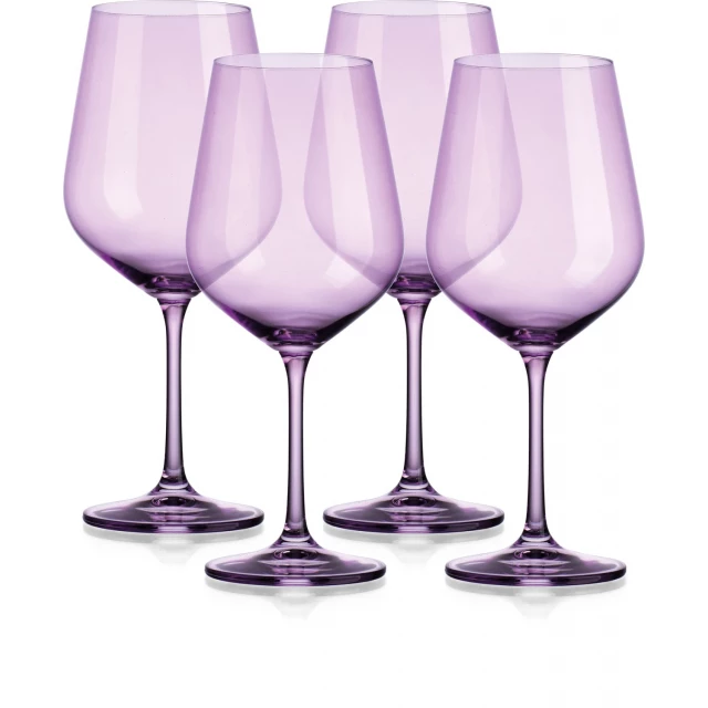 four translucent purple large wine glasses drinkware stemware on table
