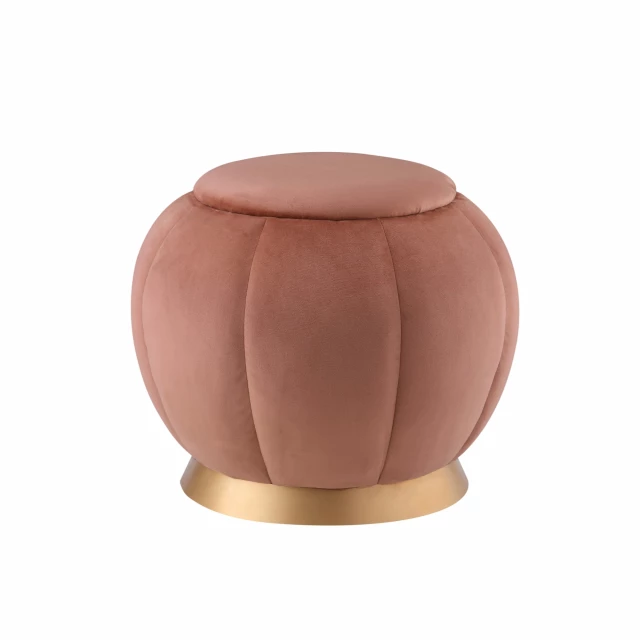 Blush velvet gold round ottoman with wood art and magenta tints in a styled setting