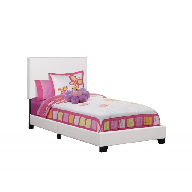 Twin white upholstered faux leather bed in a modern bedroom setting