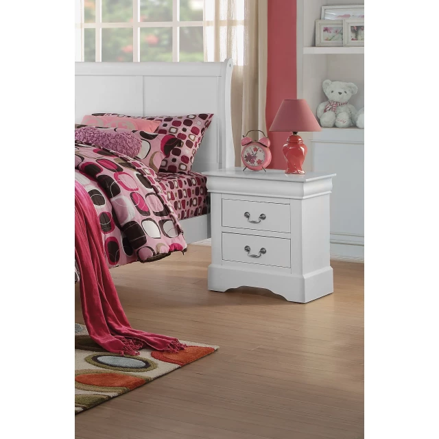 White drawers nightstand in a cozy interior design with wood flooring and picture frame