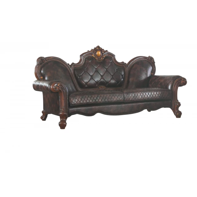 Brown faux leather sofa with toss pillows and wooden accents