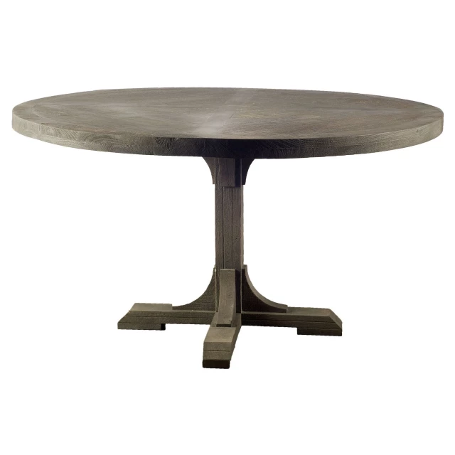 Solid wood pedestal base dining table in a well-lit room possibly used as coffee or outdoor table