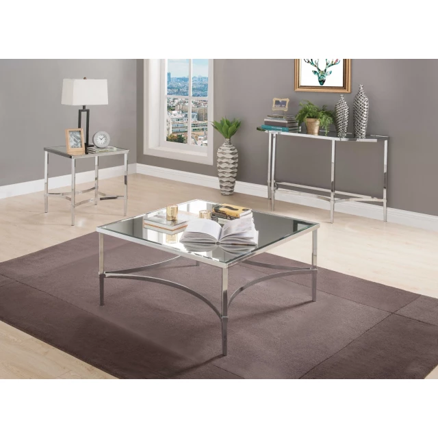 Chrome mirrored coffee table in a cozy living room with houseplants and modern furniture