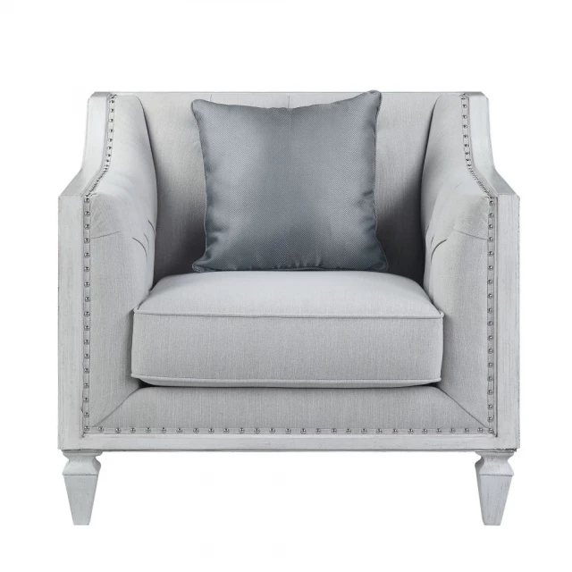 Gray linen weathered white club chair with armrests and comfortable studio couch design suitable for outdoor use