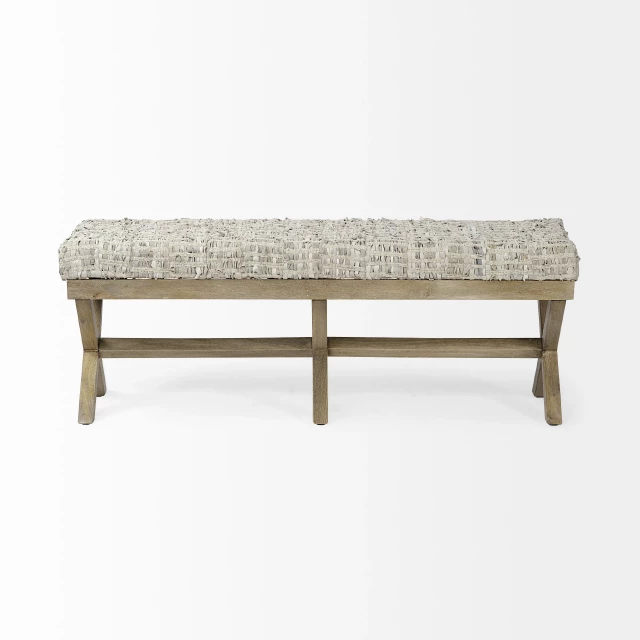 Beige brown upholstered faux leather bench with wood accents in an outdoor setting