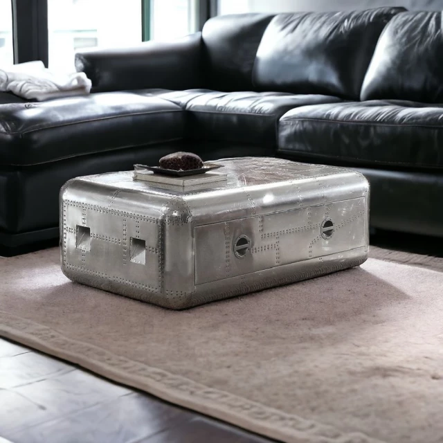 Silver aluminum coffee table with drawer in modern furniture setting