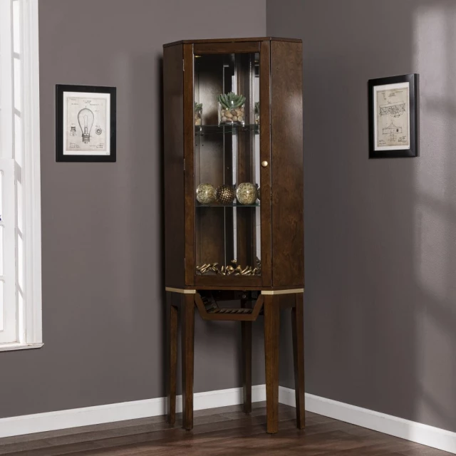Fancy tall lighted corner curio cabinet with glass doors and wood frame in interior design setting
