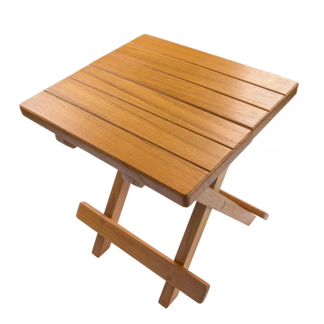 Brown solid wood square end table in a natural outdoor setting