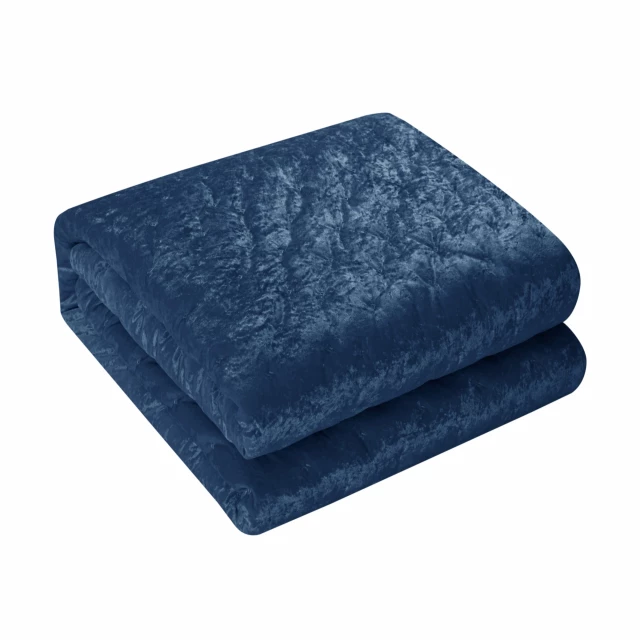 Washable polyester down comforter with a soft texture displayed on a concrete background