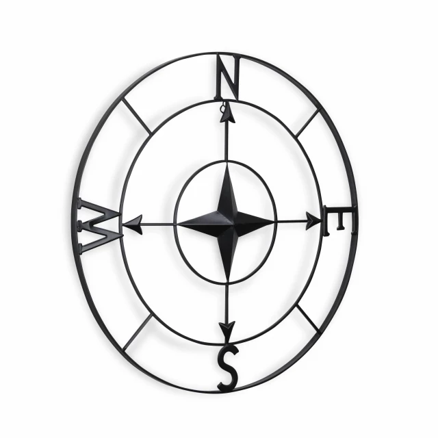 black metal compass shaped wall decor with circular pattern and symmetrical design