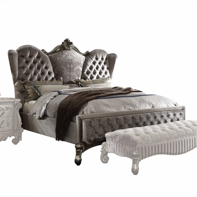 Gray upholstered velvet bed with nailhead trim
