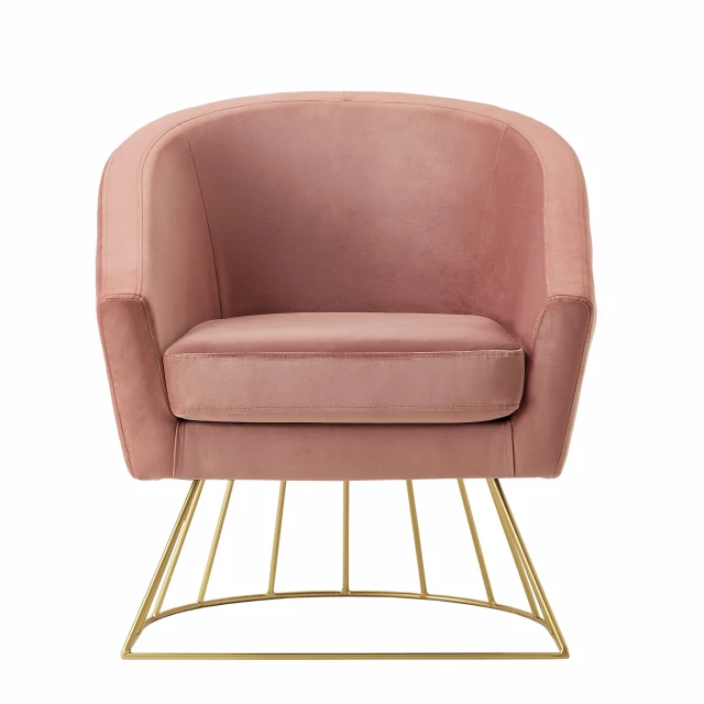 Blush gold velvet barrel chair with comfortable armrests and natural wood details