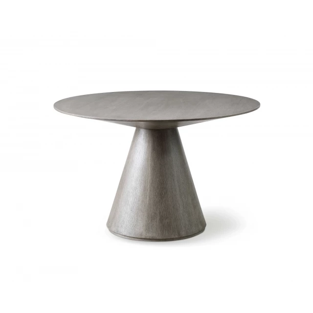 Gray solid wood dining table with metal accents and tableware on top