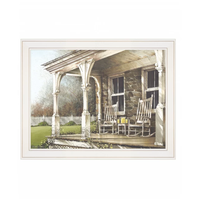 White framed print of an afternoon scene with building and tree art surrounded by plants and wood elements