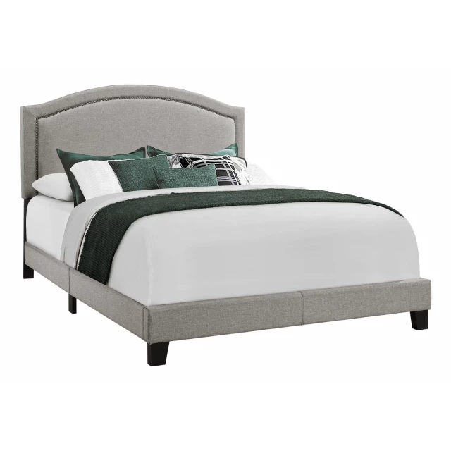 Gray upholstered linen bed with nailhead trim for bedroom decor