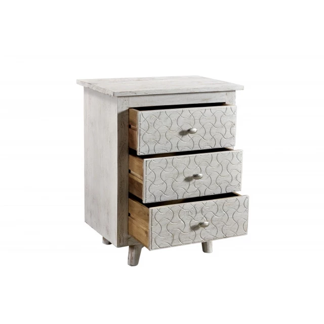 White drawer nightstand with cabinetry design and table functionality in a furnished setting