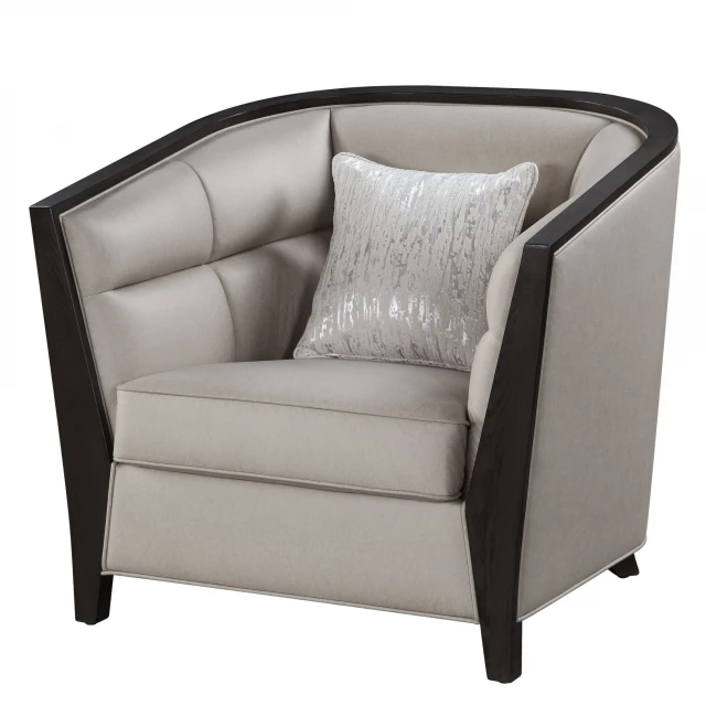 Beige fabric black barrel chair with armrests and wooden legs in a cozy outdoor setting