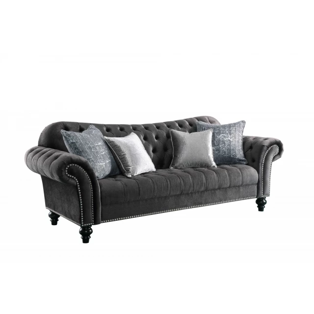 Dark gray velvet sofa pillows on a comfortable studio couch furniture