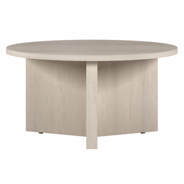 White round coffee table with wood stain finish in a furniture setting