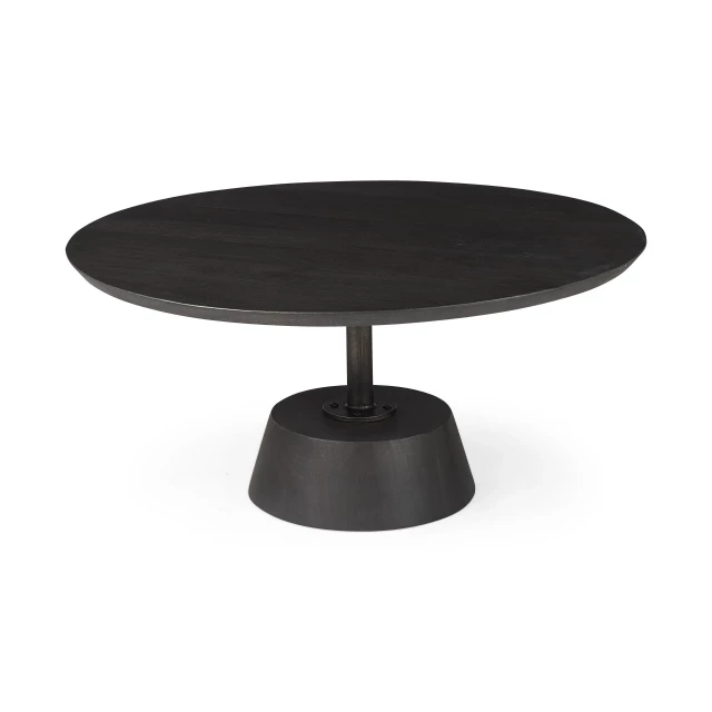 Black wooden pedestal base coffee table with chairs in an outdoor setting