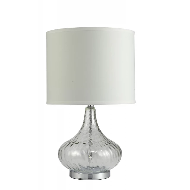 clear textured glass table lamp on wooden surface