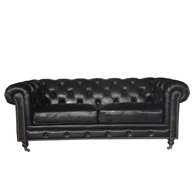 Black leather sofa with comfortable cushioning and modern design