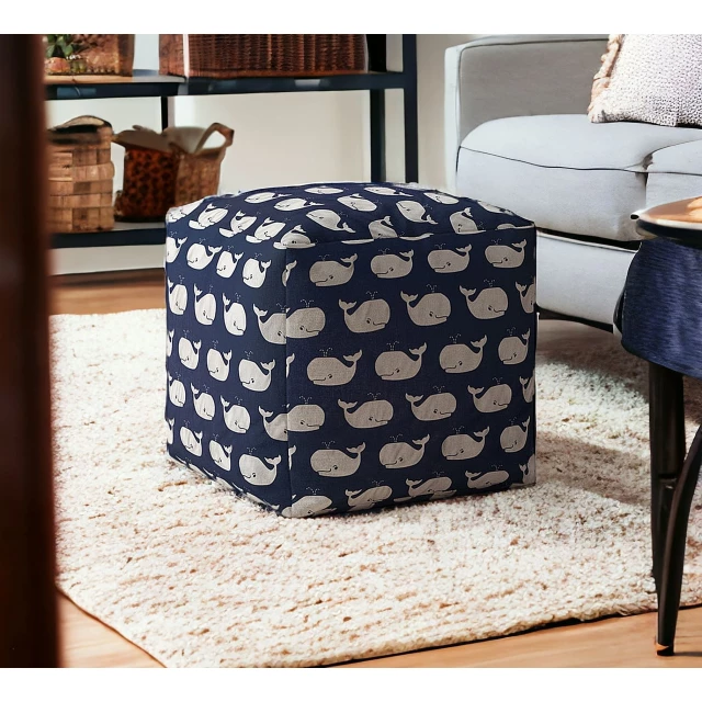 Blue twill whale pouf cover on wooden floor with cozy interior design elements