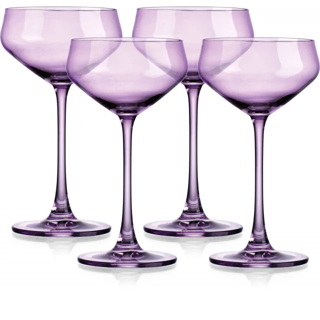 four translucent purple coupe glasses drinkware stemware on table