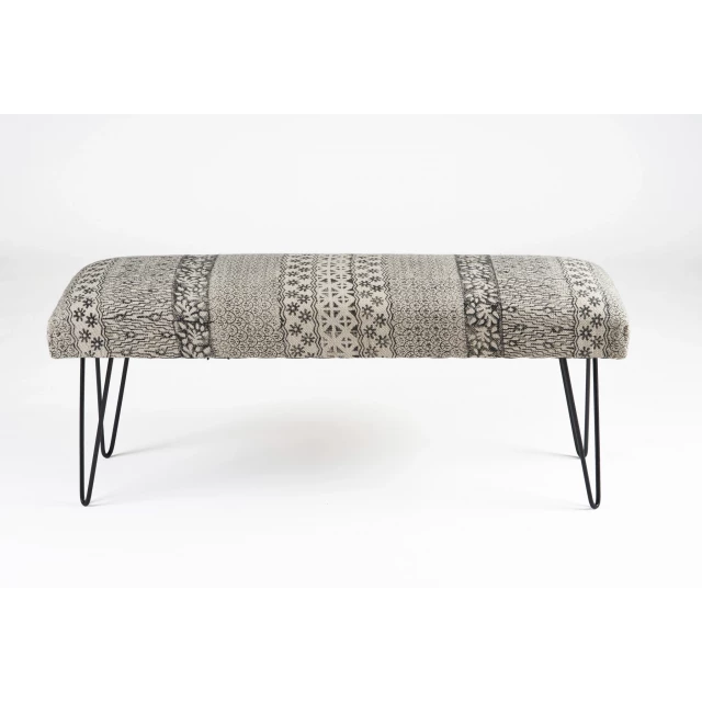 Black leg abstract floral upholstered bench with metal accents and leather details