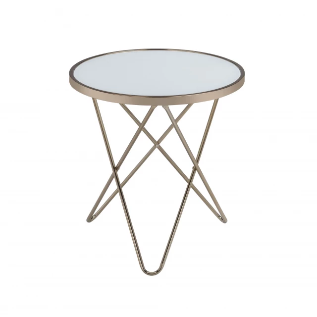 Brass clear glass round end table with metal base in an outdoor setting