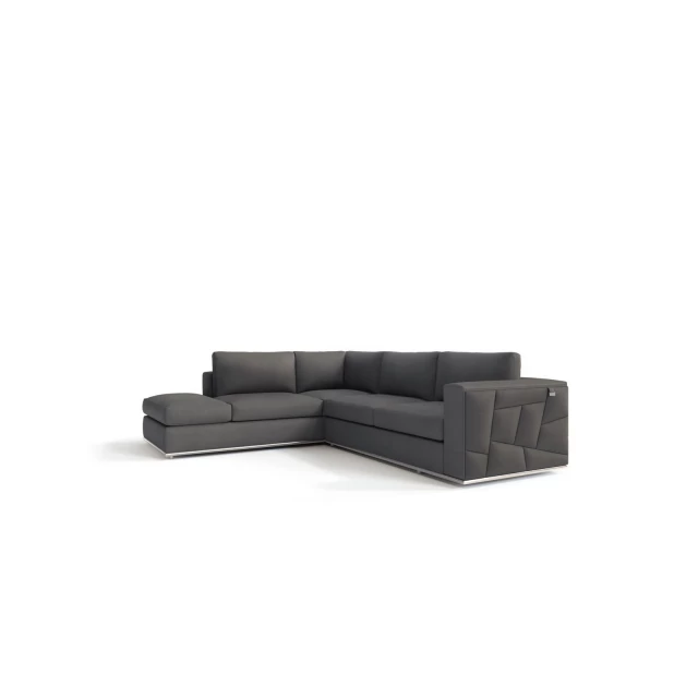 Leather reclining L-shaped corner sectional in a studio setting with wooden accents and comfortable cushions