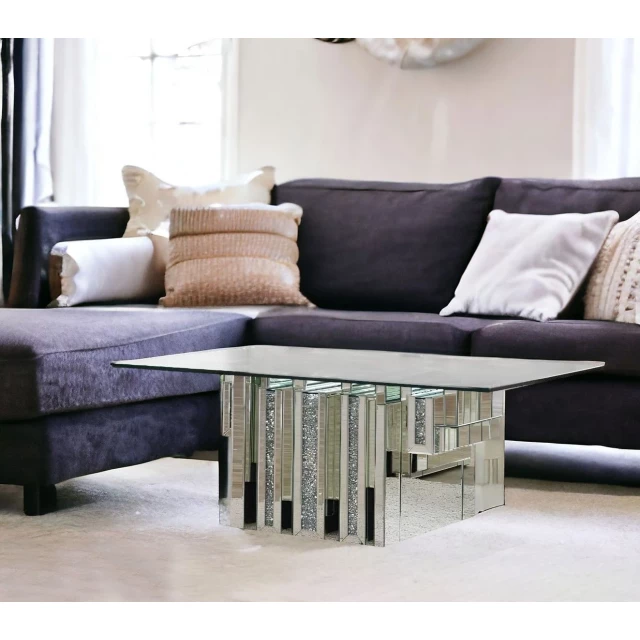 Silver mirrored coffee table with glass finish and modern interior design elements