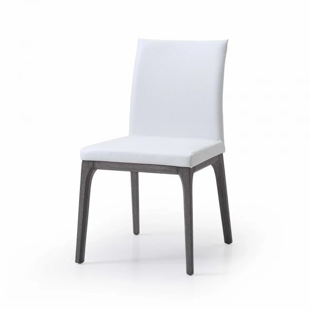 White faux leather dining chairs with wood table in modern furniture setting