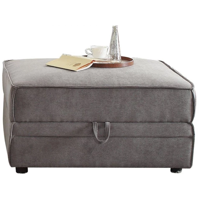 Gray velvet storage ottoman with silver accents in furniture category