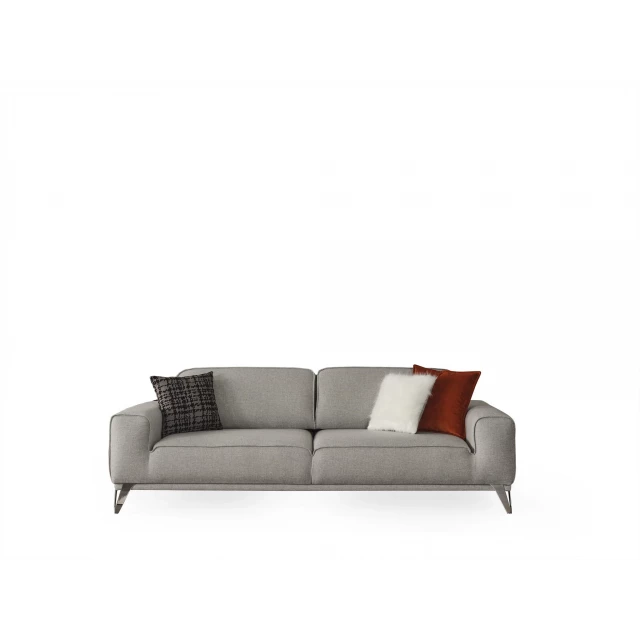 Linen sleeper sofa with toss pillows and wooden frame in a comfortable living room setting