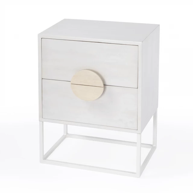 Off white nightstand with drawers and natural wood finish beside a plant