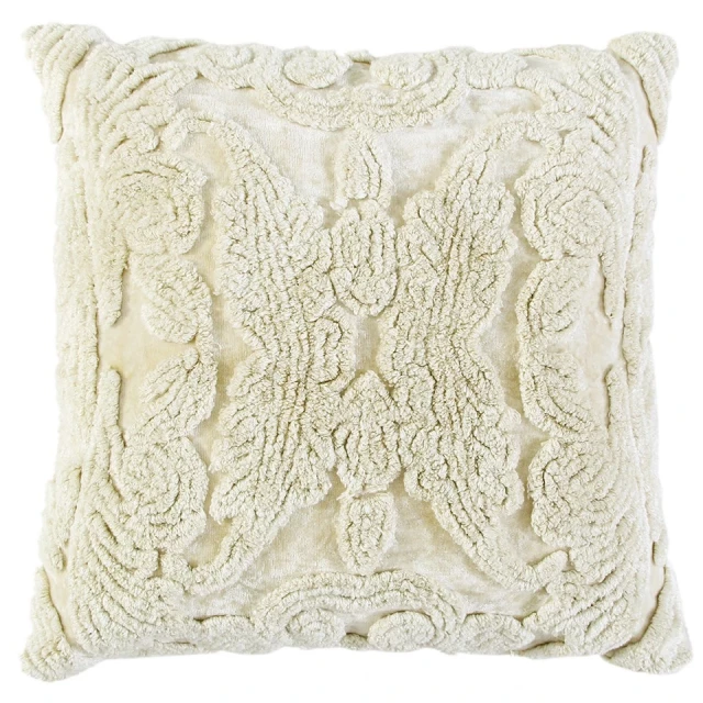 ivory botanical tufted pattern throw pillow with beige symmetrical embellishments on linens