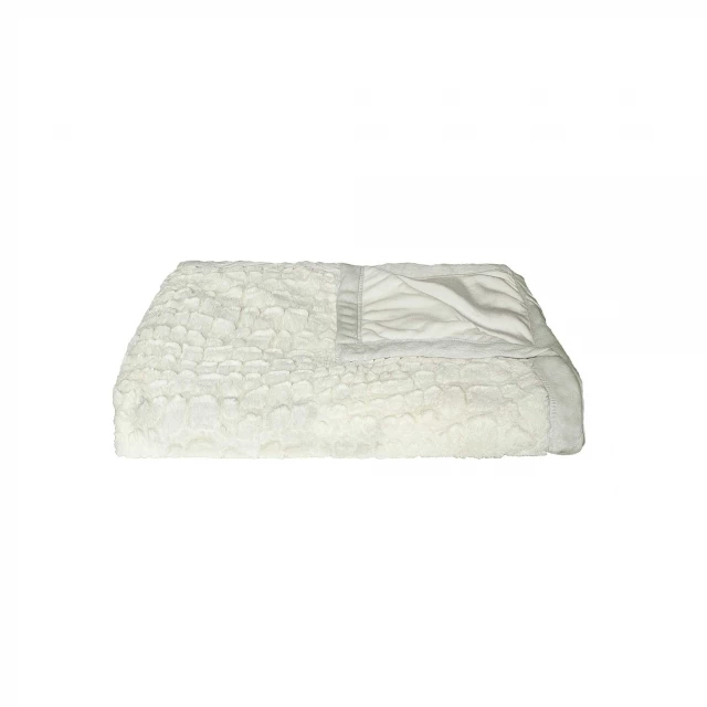 Product image of ivory faux fur plush throw on beige flooring with linens and fashion accessory