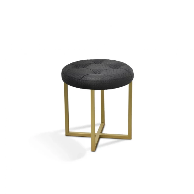 Black tufted faux leather stool with gold legs and circular base for modern home decor