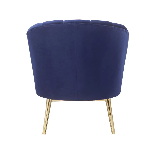 Blue copper velvet tufted barrel chair with wood accents and plush upholstery in electric blue shade