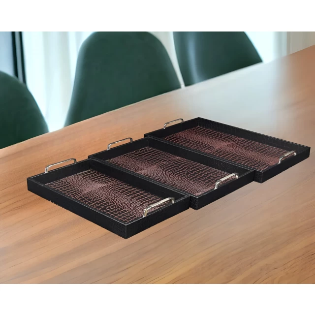 rectangular faux alligator tray with chrome handles on wooden table