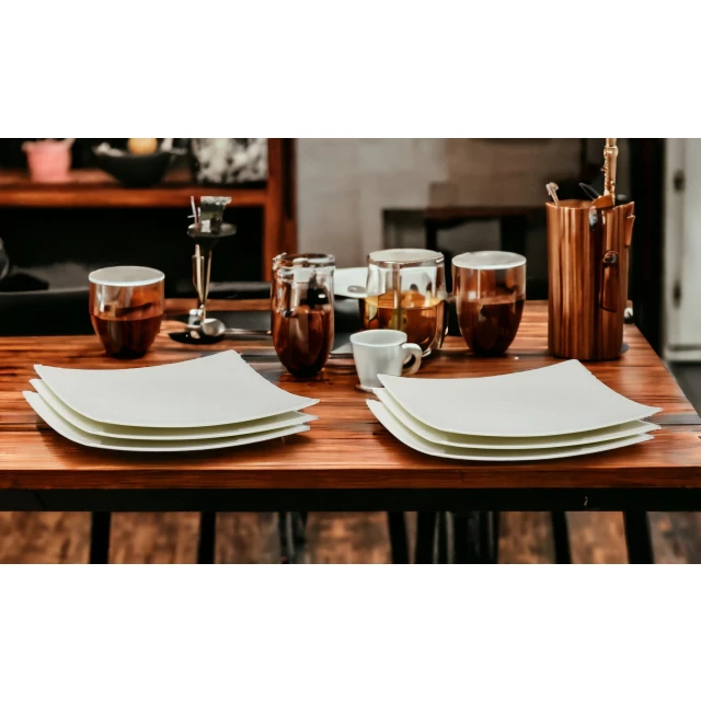 Bone china service for six with salad plates on wooden table featuring tableware and drinkware