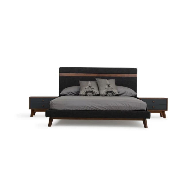 Grey fabric upholstered walnut queen-sized bed in a bedroom setting
