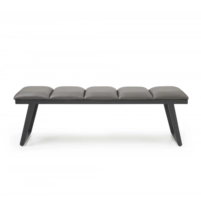 Gray upholstered faux leather bench in modern home office setting