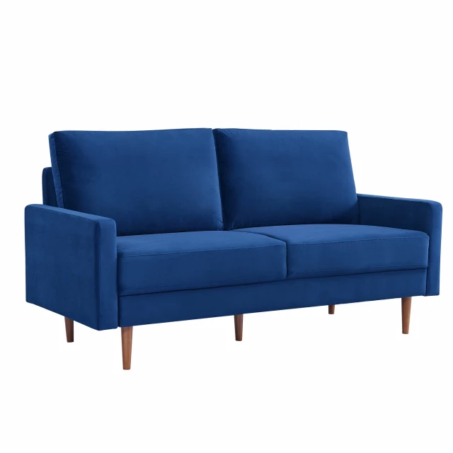 Blue velvet dark brown sofa with pillows in a comfortable outdoor furniture setting