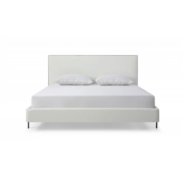 White upholstered faux leather bed with built-in USB ports